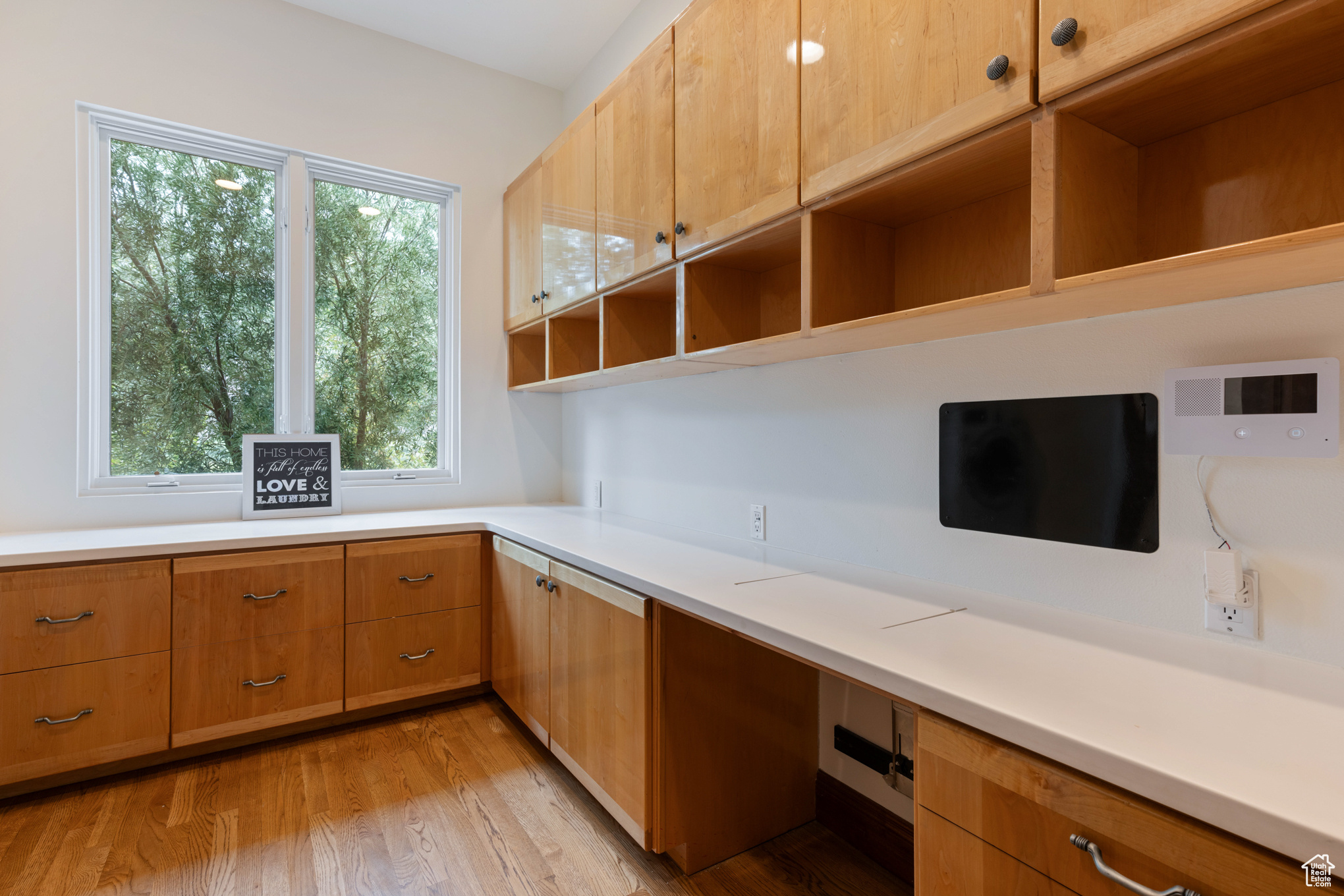 Unfurnished office with light wood-type flooring