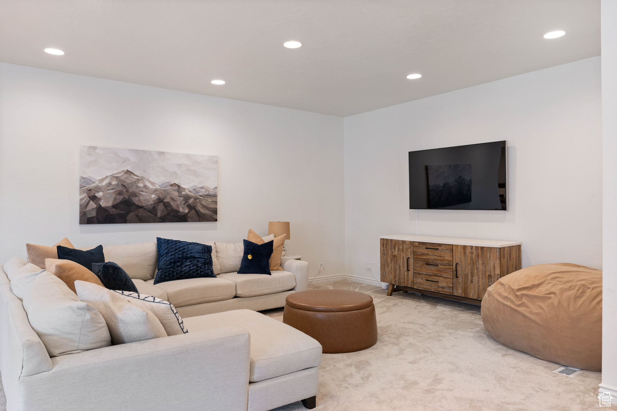 Living room with light colored carpet