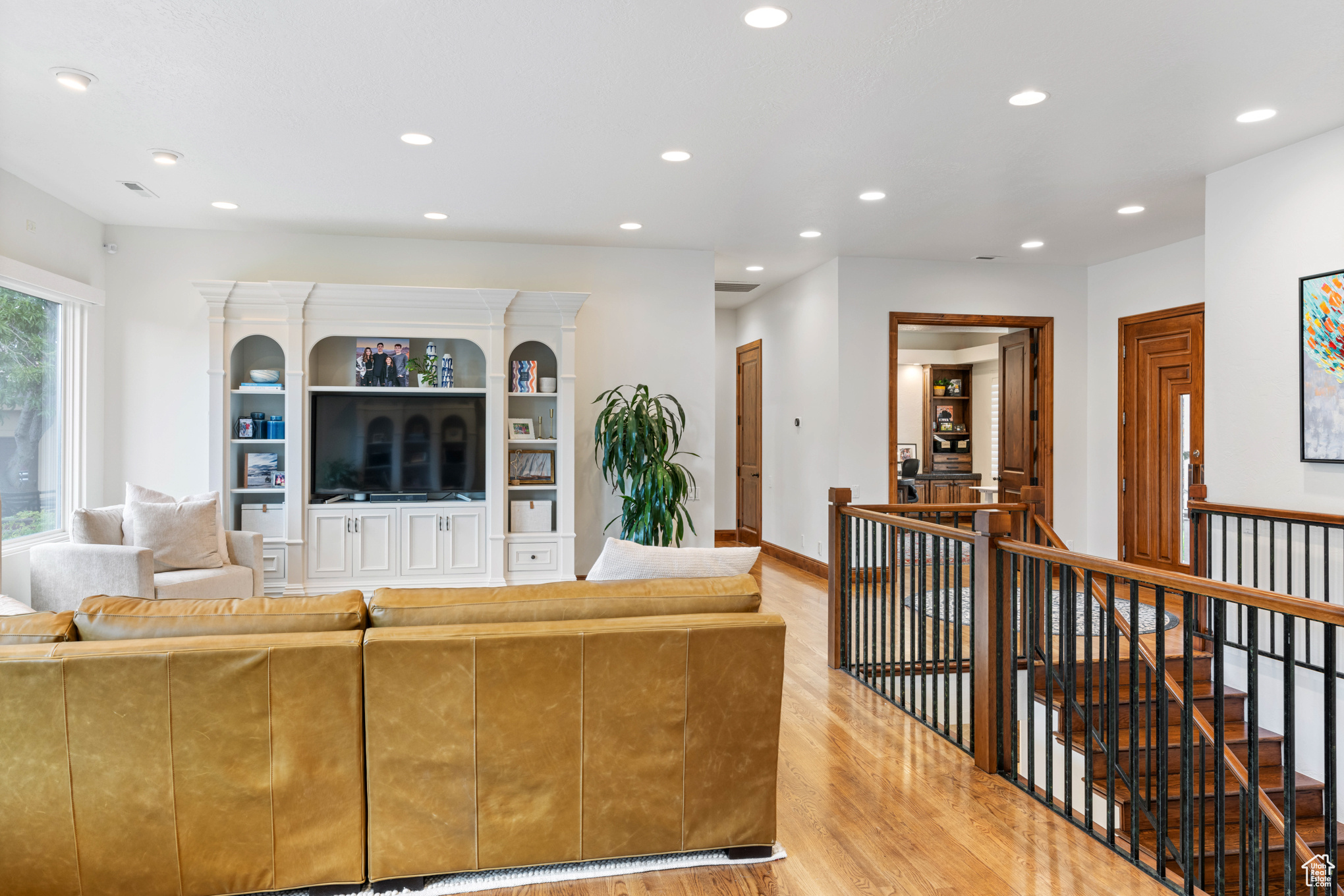 Living room with light hardwood / wood-style flooring