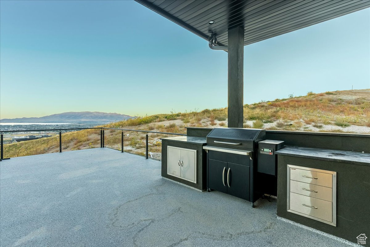 View of patio / terrace featuring a mountain view and an outdoor kitchen