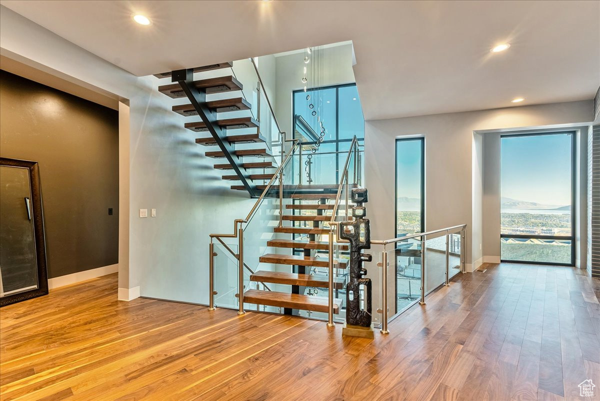 Stairway featuring wood-type flooring