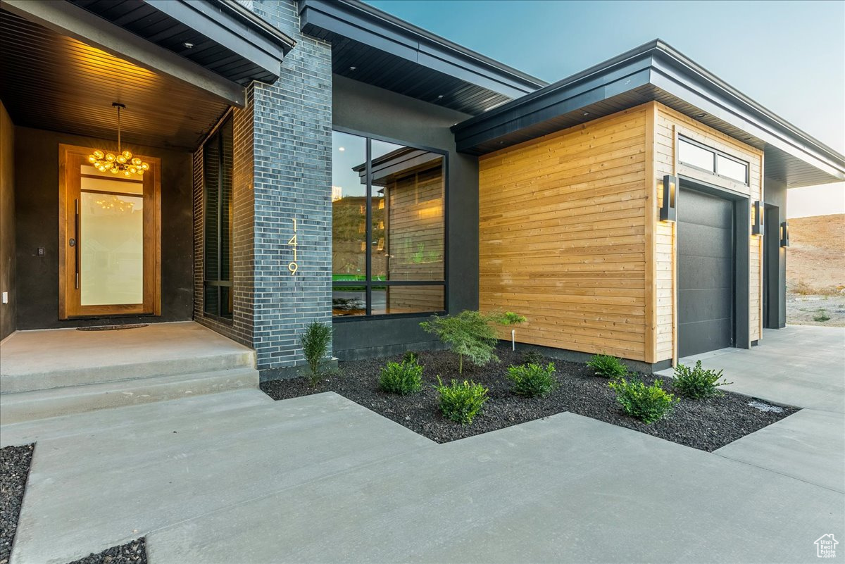 View of exterior entry featuring a porch