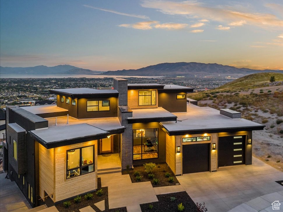 Prairie-style home featuring a mountain view and a garage