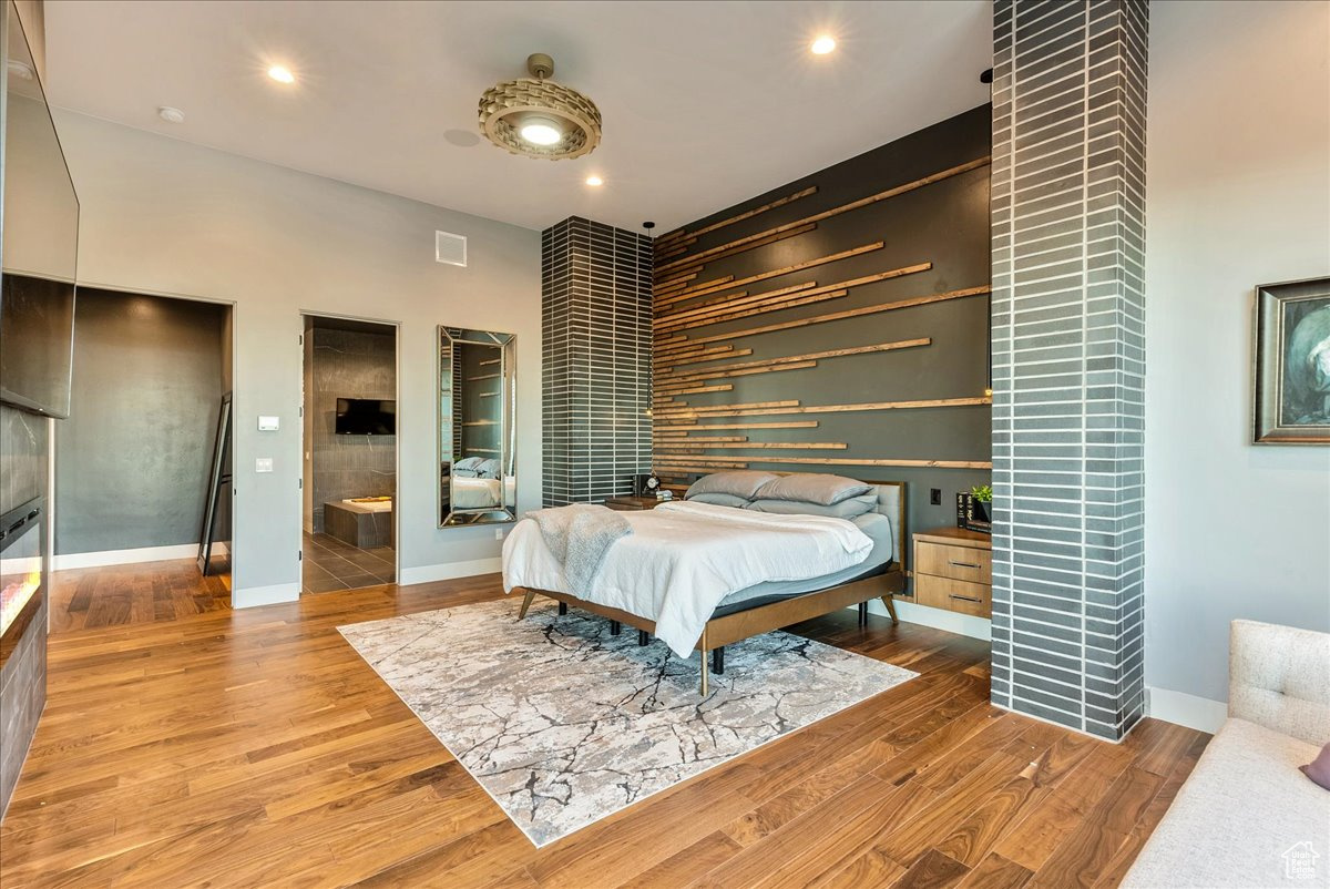 Bedroom with wood-type flooring