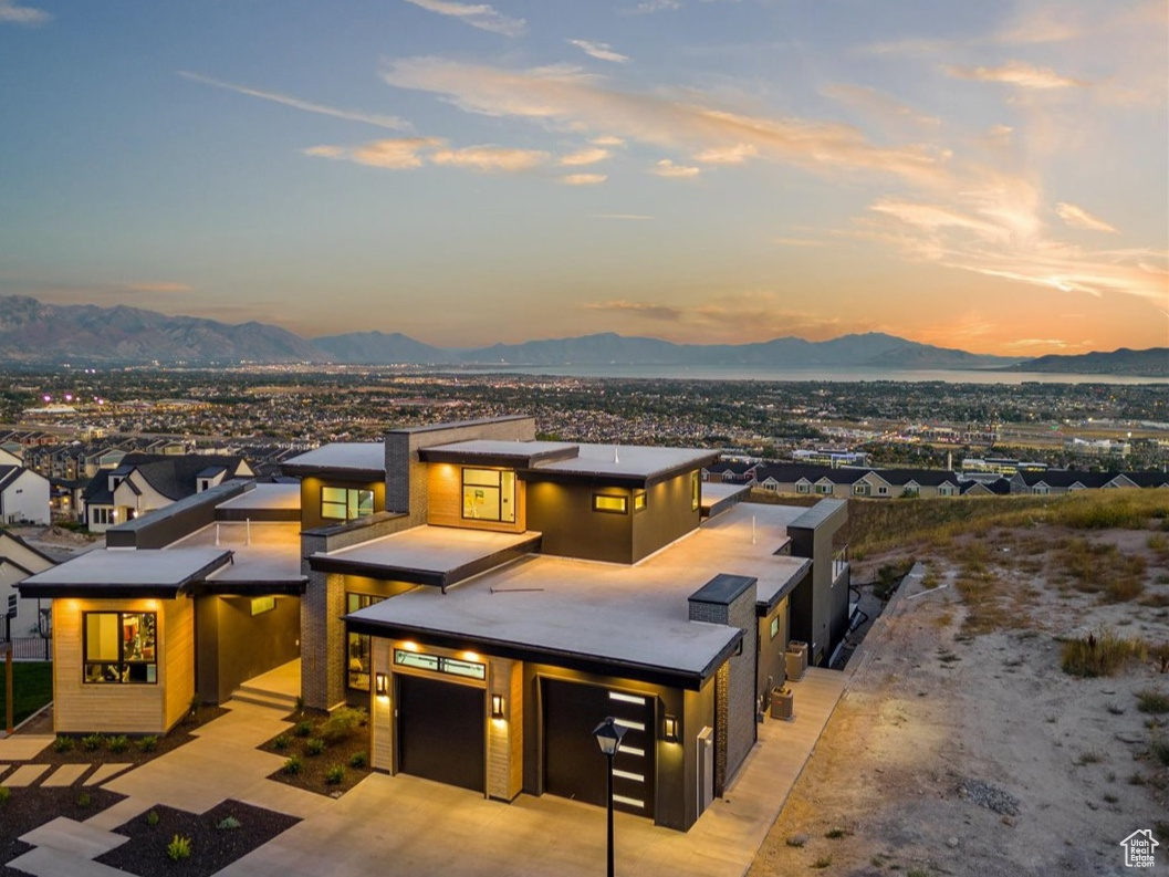 View of front of house featuring a mountain view and a garage