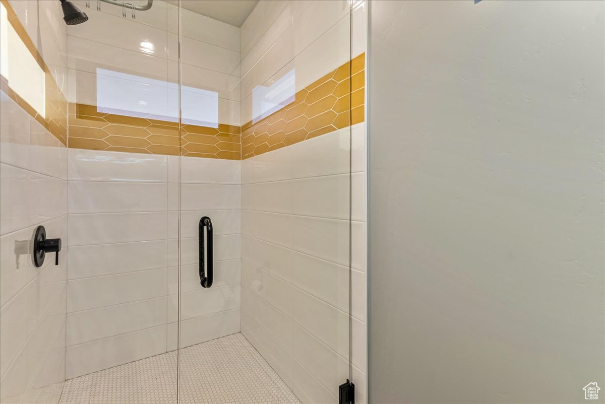 Bathroom with a shower with door