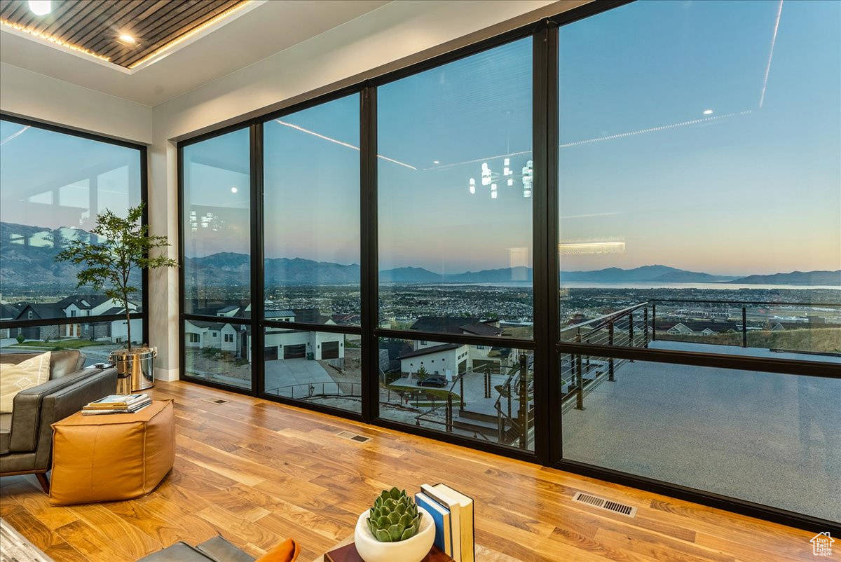 Sunroom / solarium with a mountain view and wooden ceiling