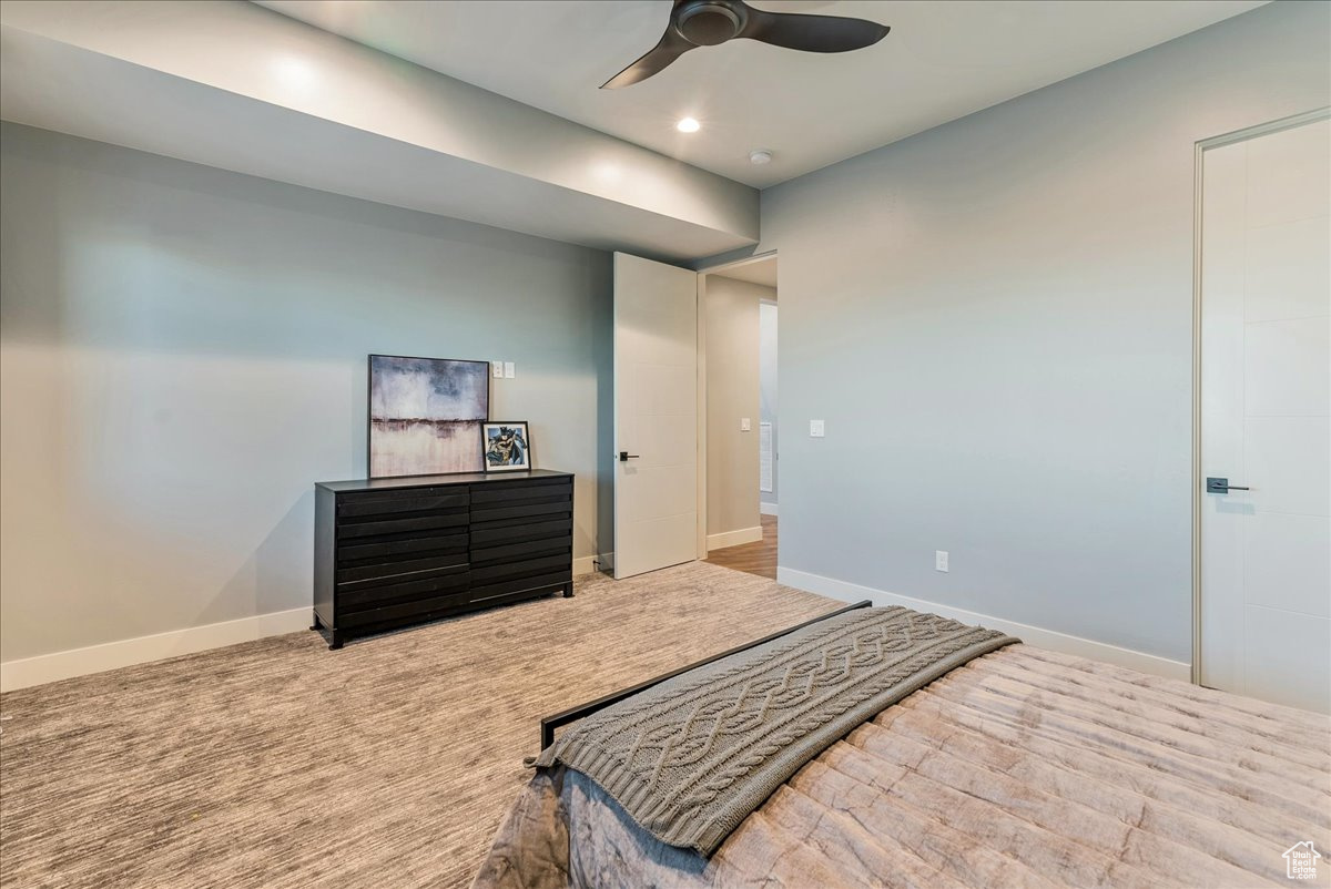 Bedroom featuring carpet and ceiling fan