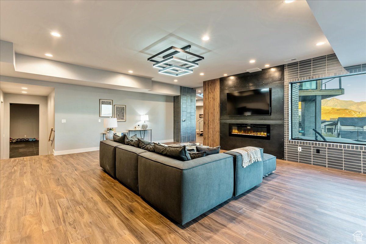 Living room featuring hardwood / wood-style floors and a fireplace