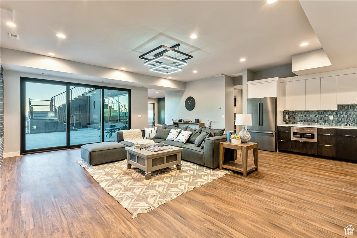 Living room with light hardwood / wood-style flooring