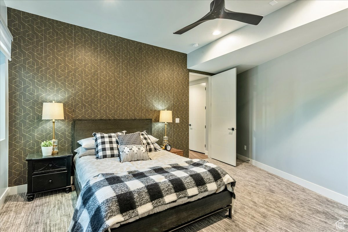 Bedroom featuring carpet flooring and ceiling fan