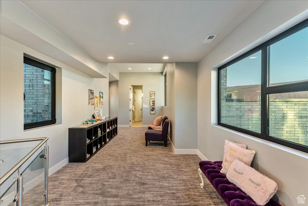 Living area with carpet flooring