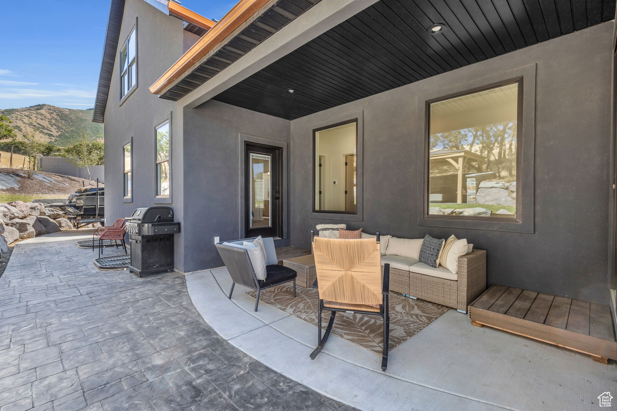 View of patio featuring a mountain view, outdoor lounge area, and a grill