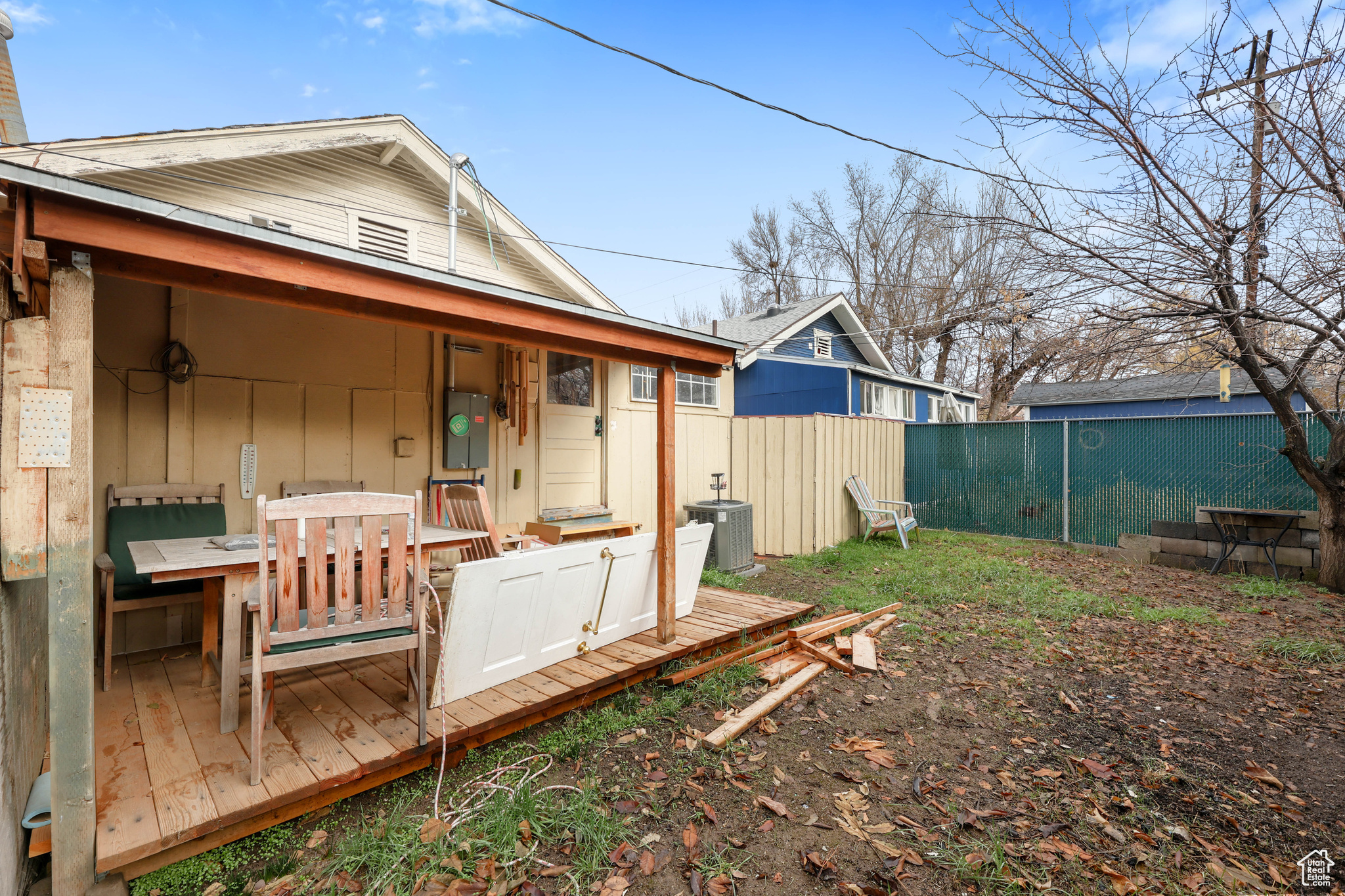 Back of house with central AC unit