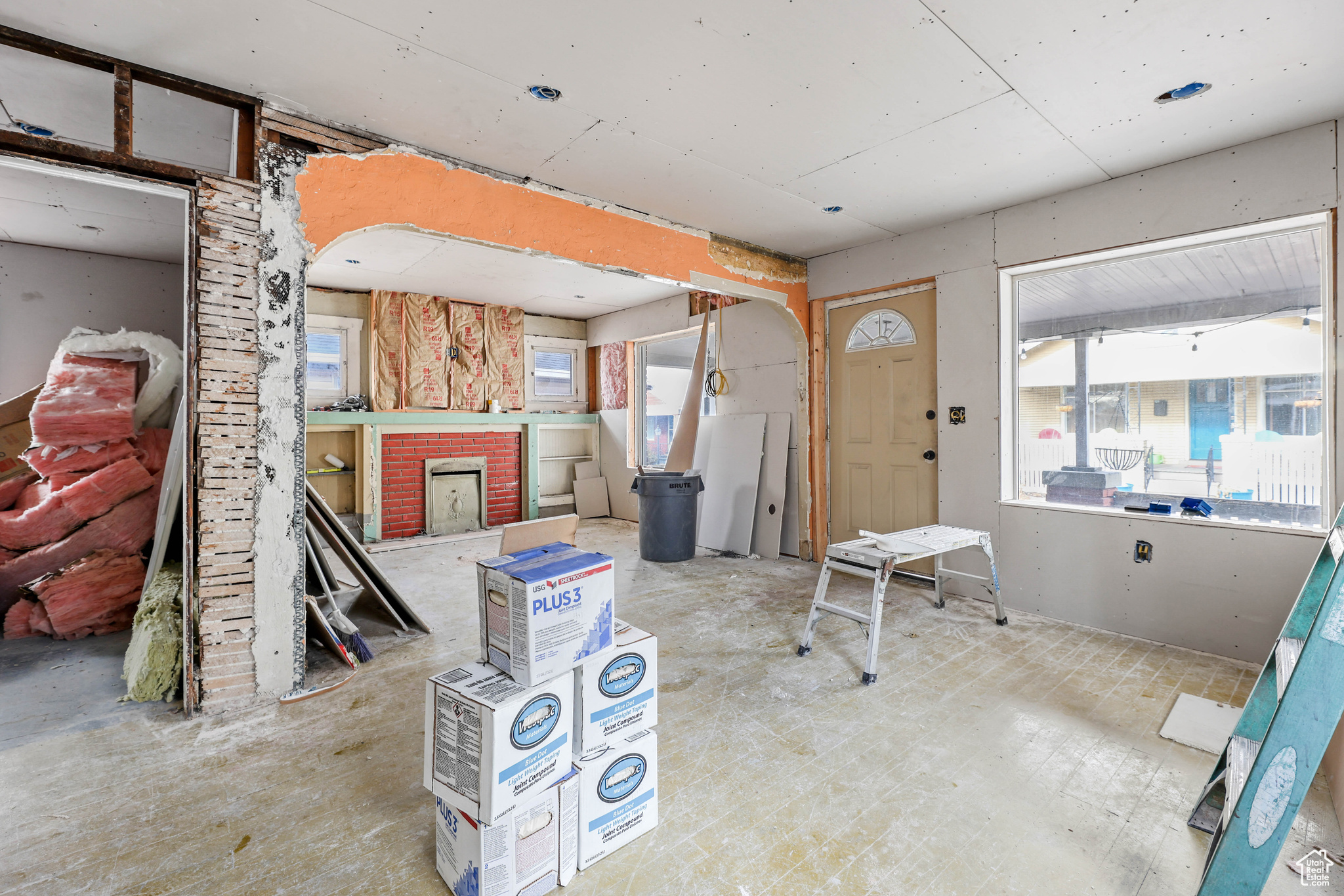 Misc room with a brick fireplace