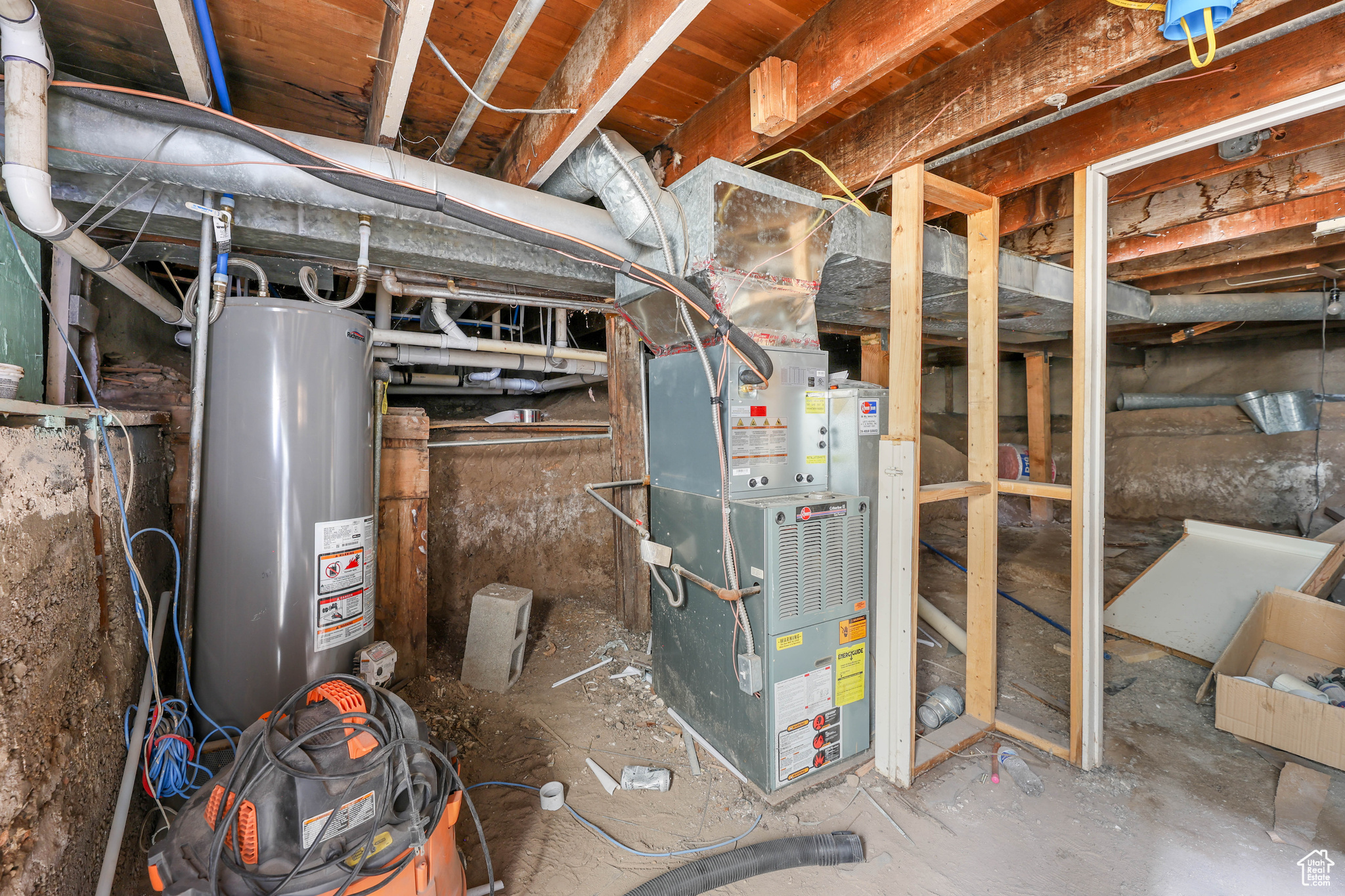 Utilities featuring heating unit and water heater