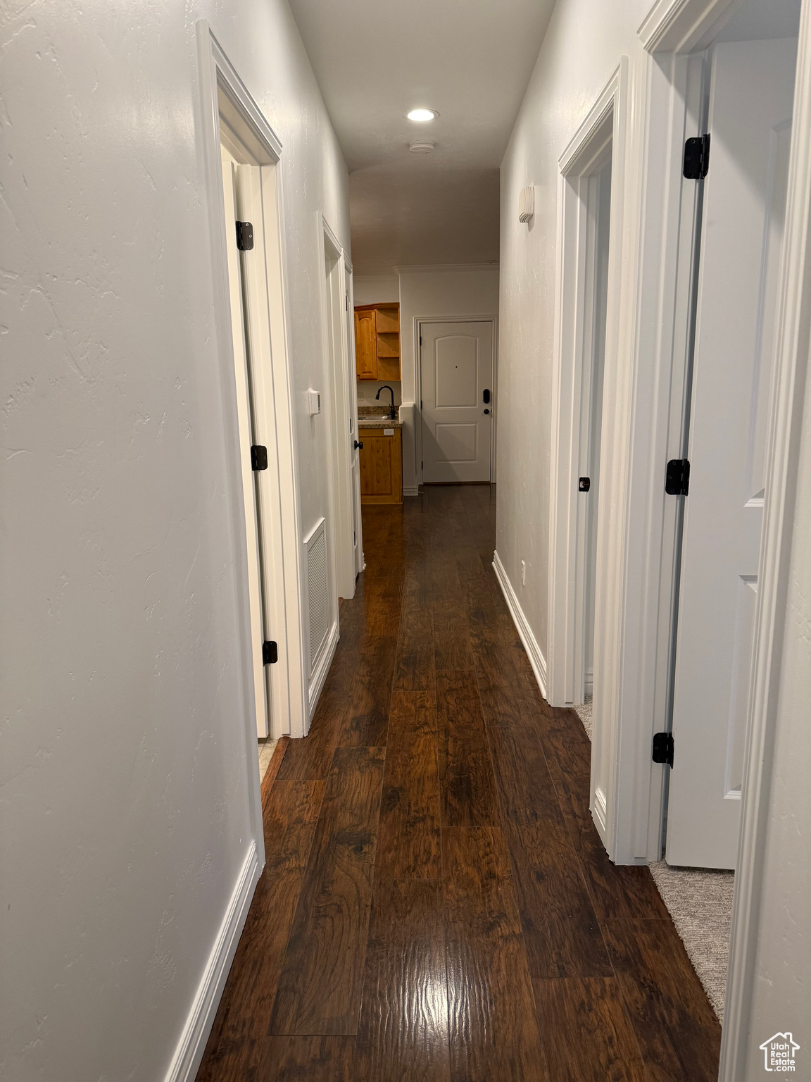 Hall featuring dark hardwood / wood-style floors