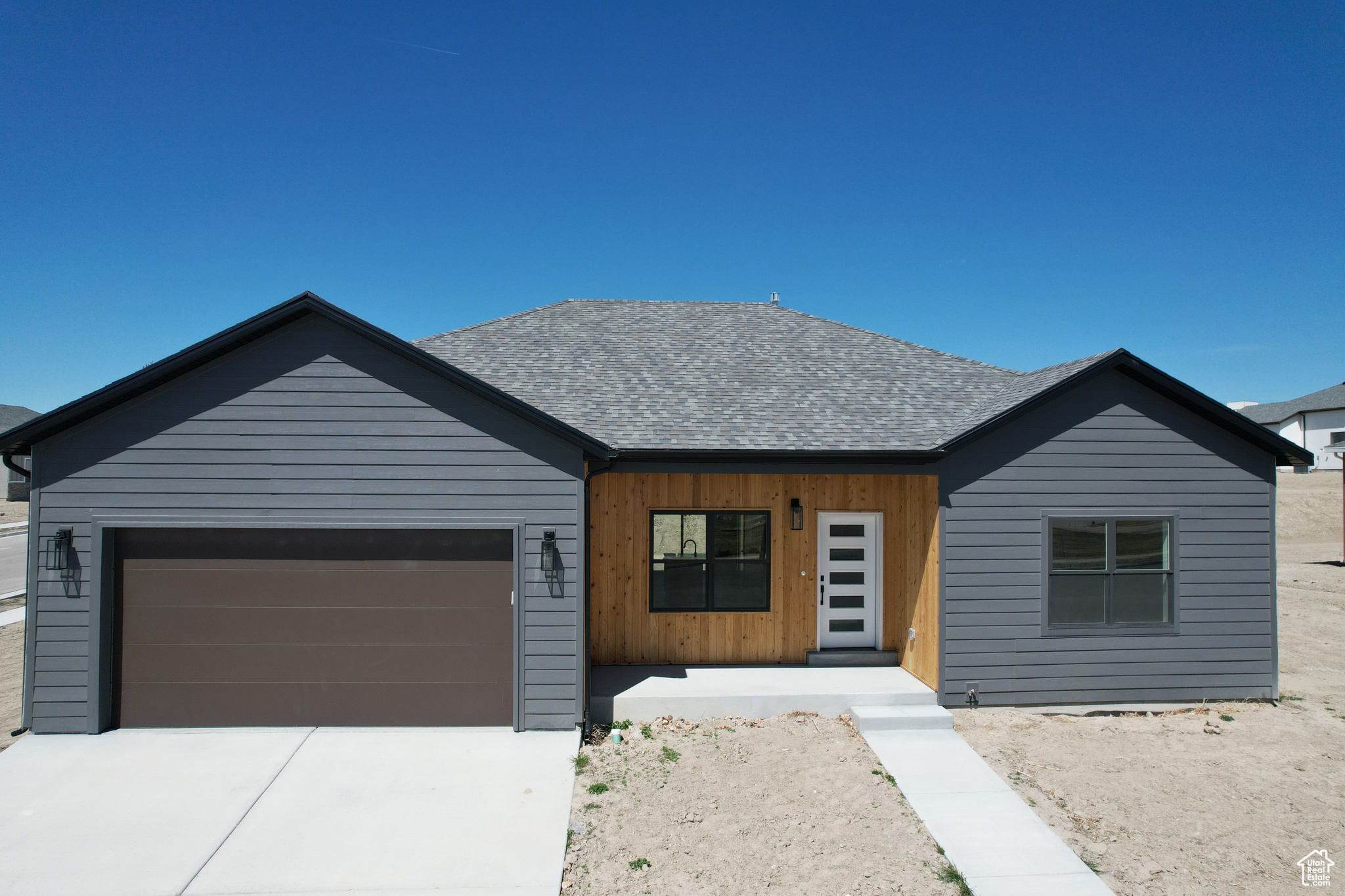 Ranch-style house featuring a garage