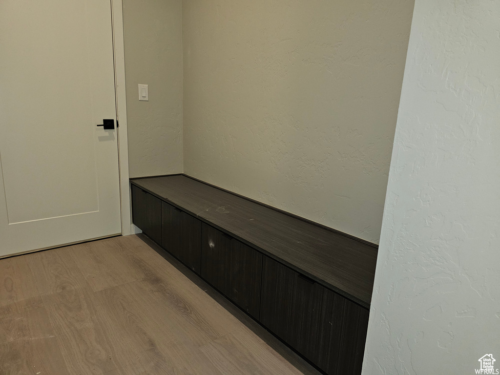 Mudroom with light hardwood / wood-style flooring