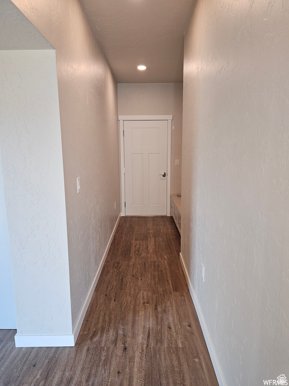 Corridor featuring dark hardwood / wood-style flooring