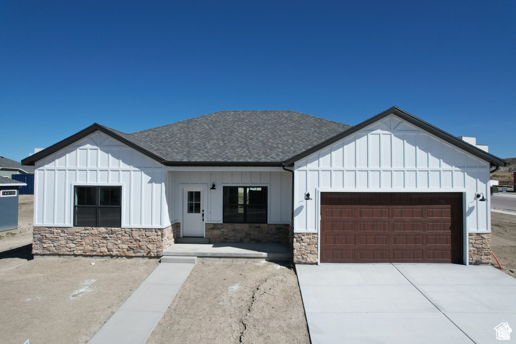 Modern inspired farmhouse with a garage