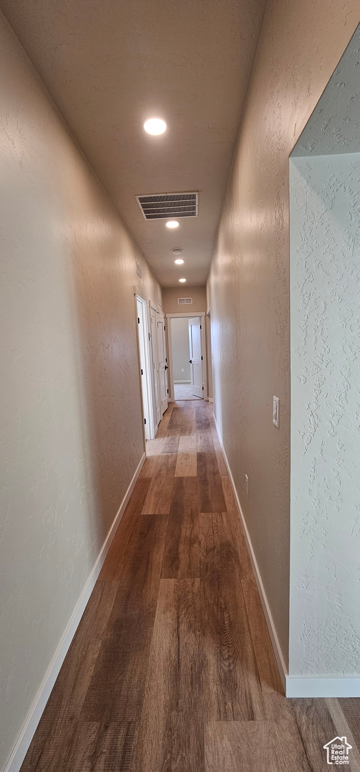 Hallway featuring hardwood / wood-style flooring