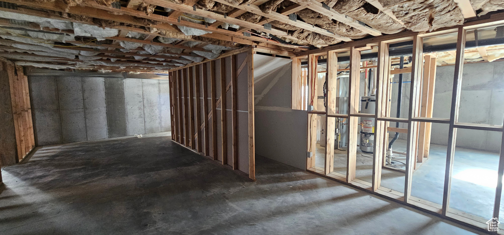 Basement with strapped water heater