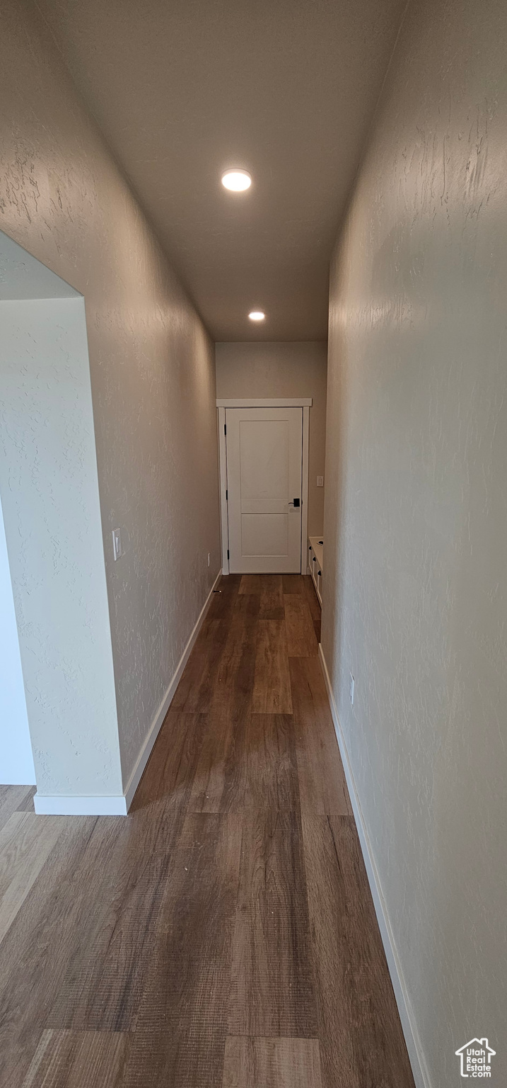 Corridor featuring dark hardwood / wood-style flooring