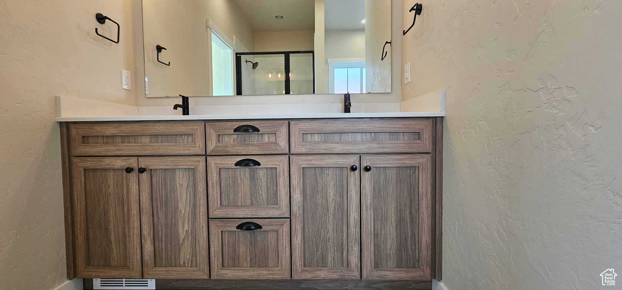 Bathroom with vanity and an enclosed shower