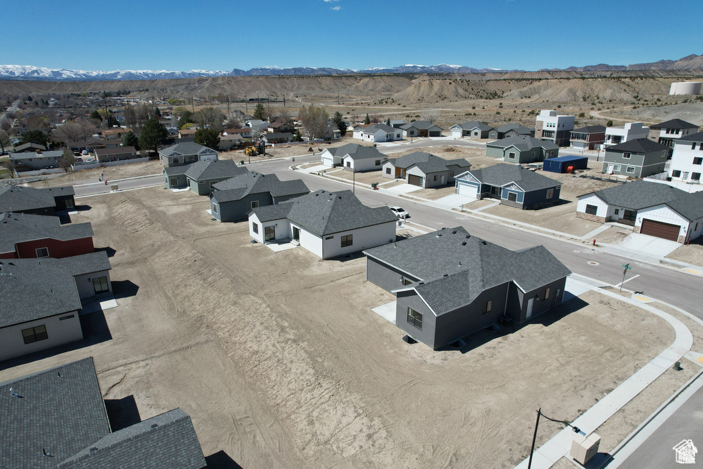 Birds eye view of property with a mountain view