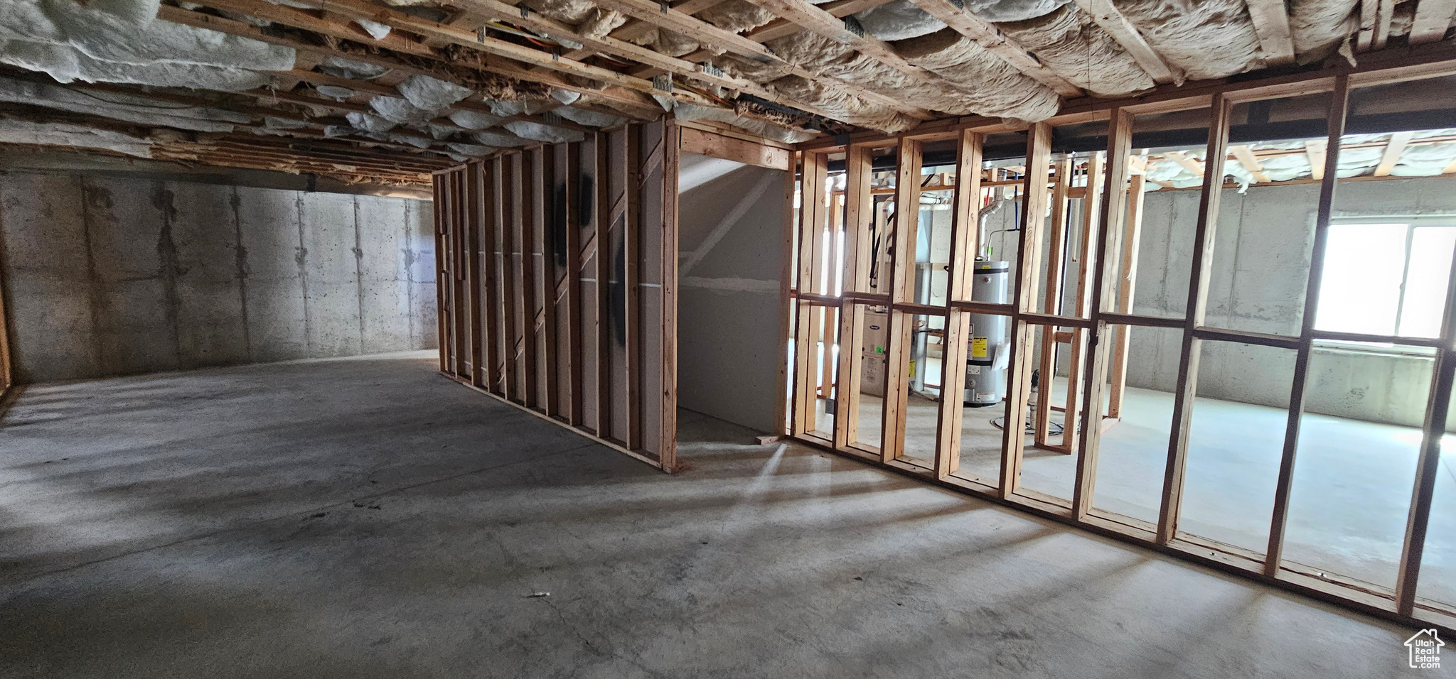 Basement featuring water heater