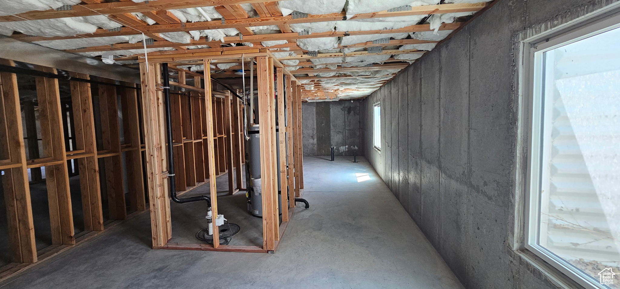 Basement featuring water heater