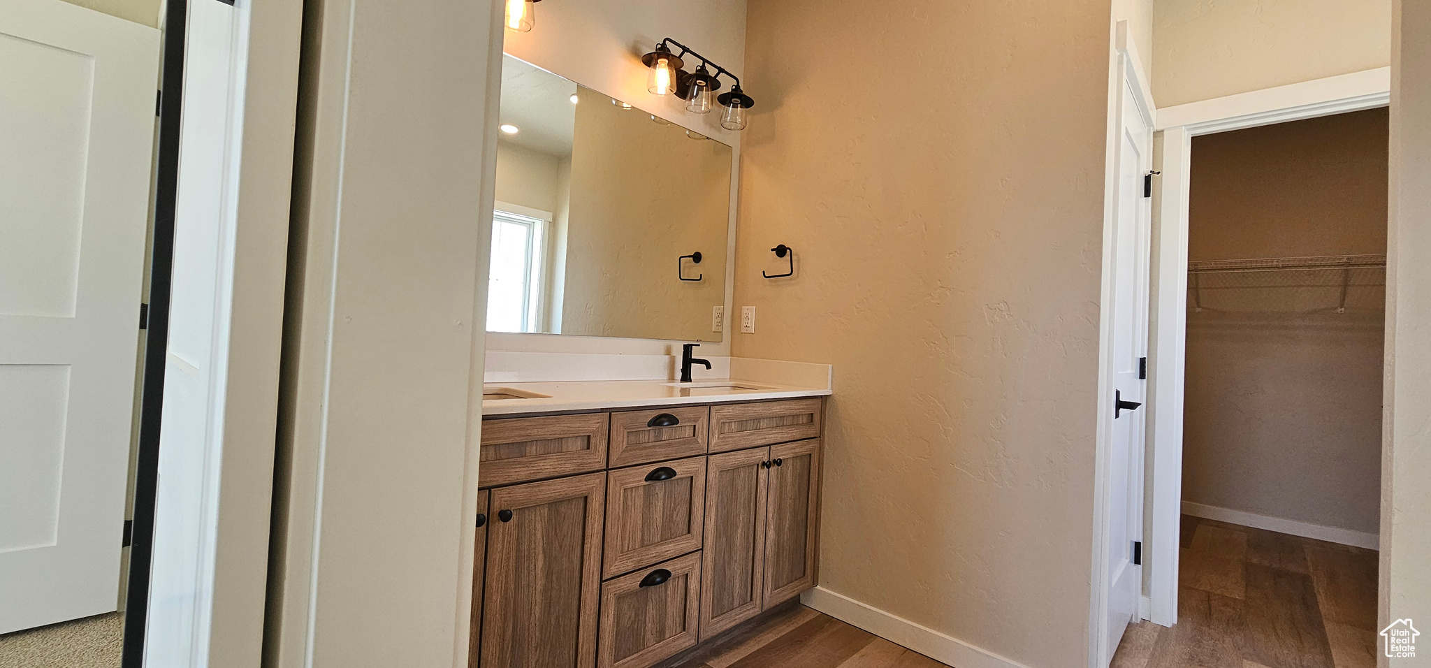 Bathroom with vanity and hardwood / wood-style flooring