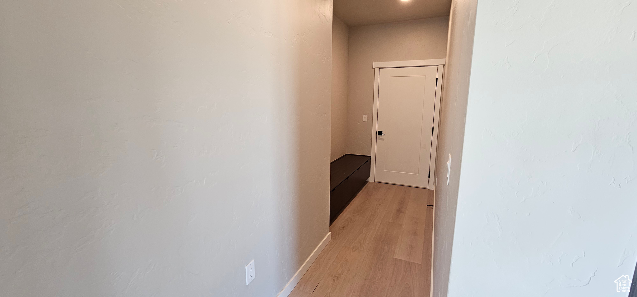 Corridor featuring light hardwood / wood-style floors