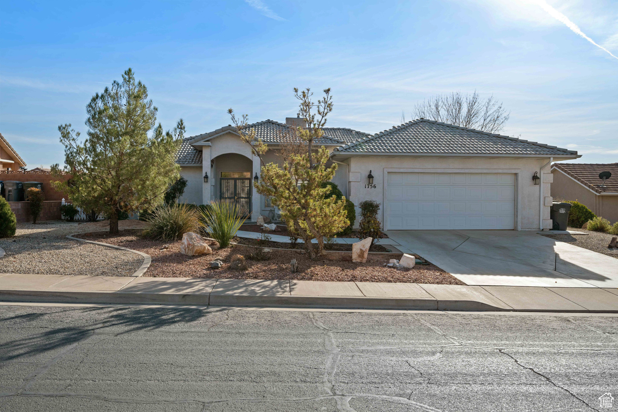 View of front of property featuring a garage