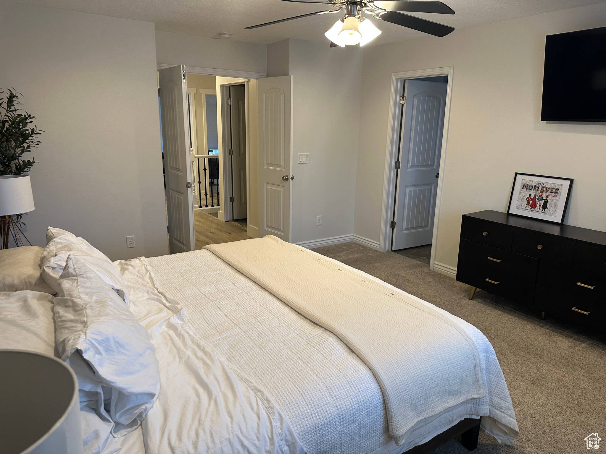 Bedroom with ceiling fan and carpet floors