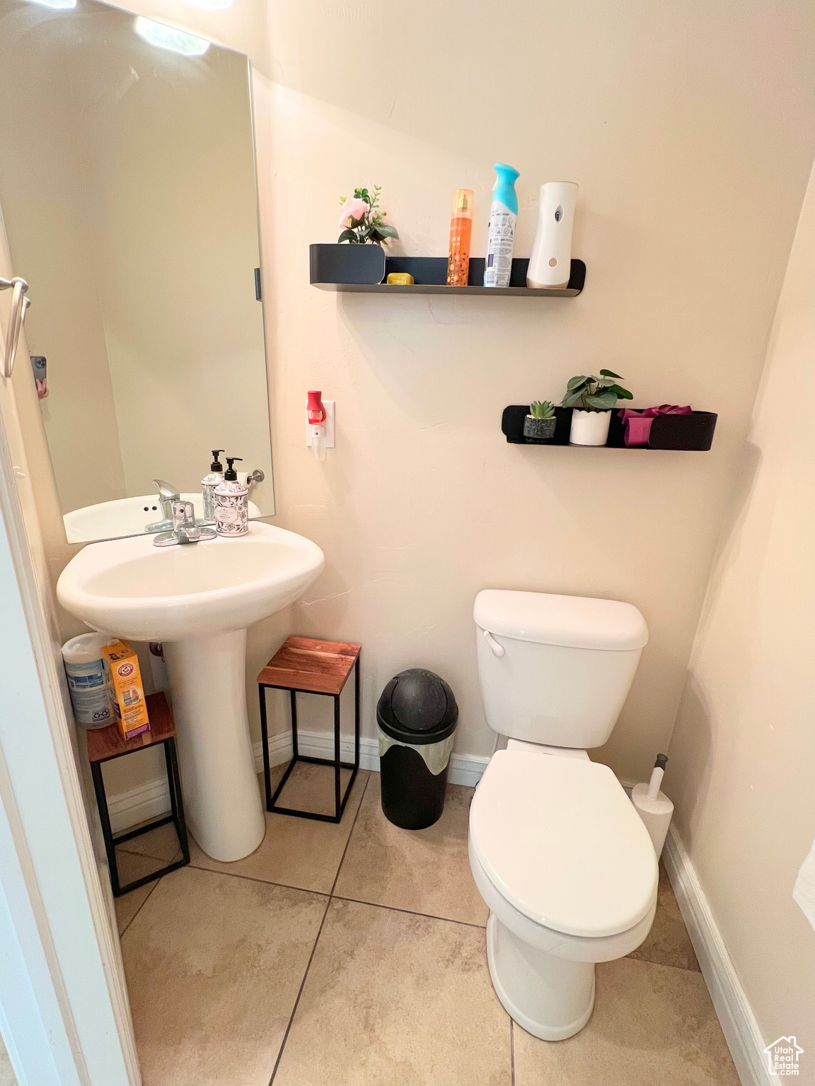 Bathroom featuring tile patterned floors and toilet