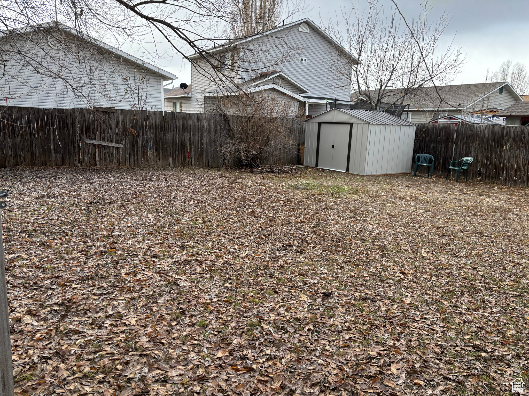 View of yard with a storage shed