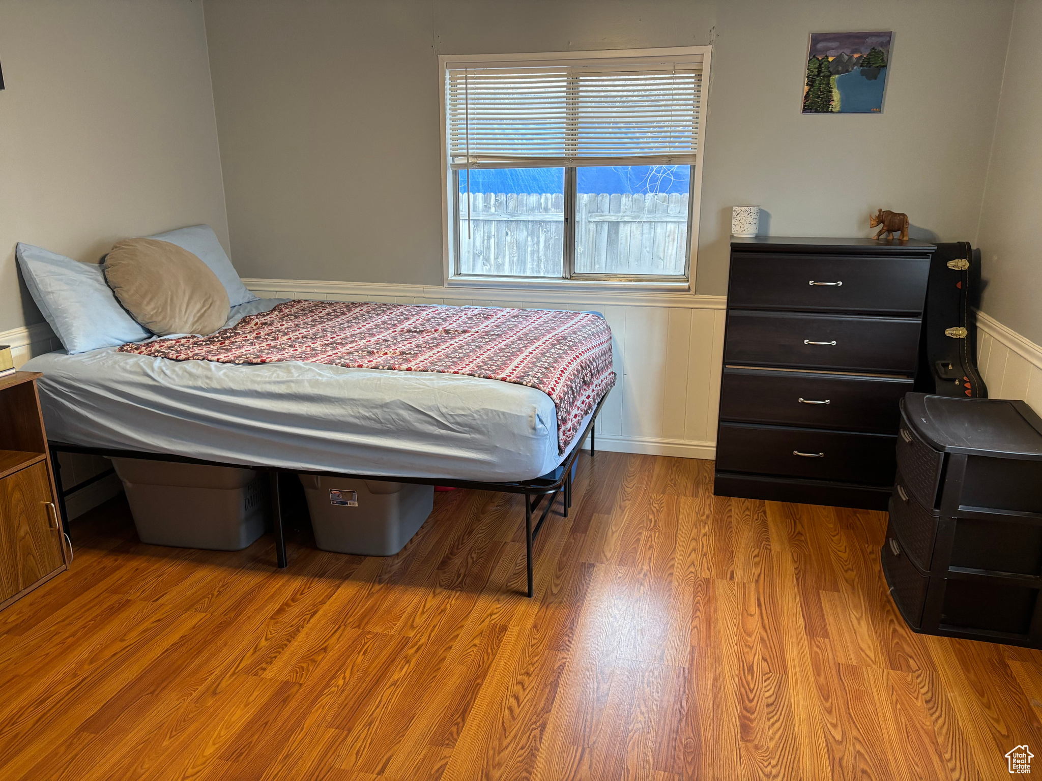 Bedroom with light hardwood / wood-style flooring