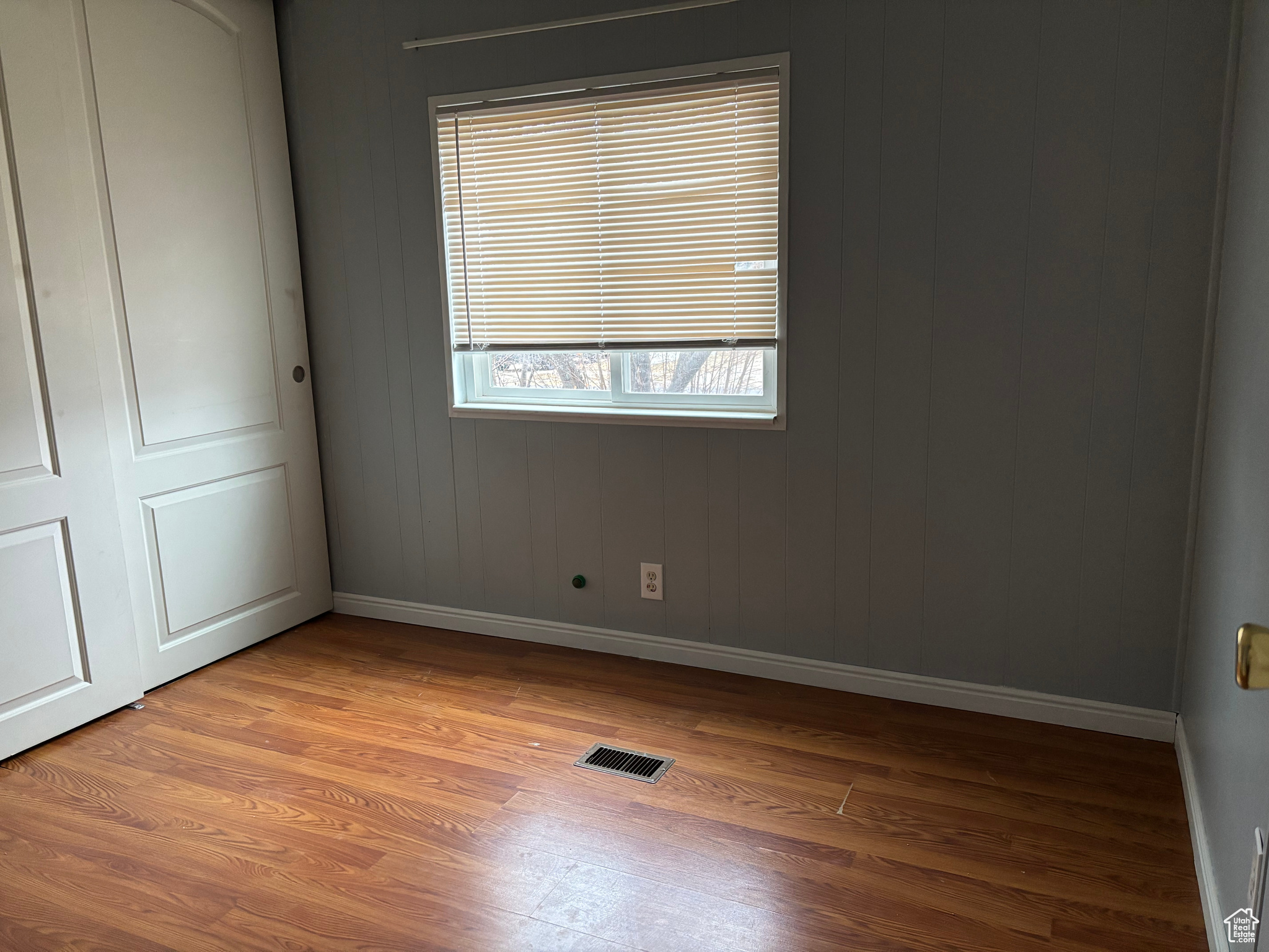 Spare room with light wood-type flooring