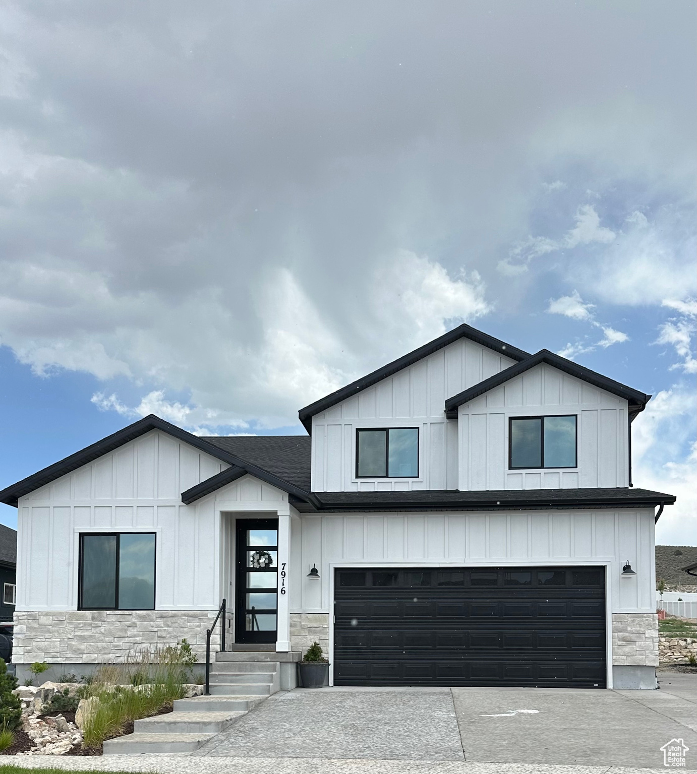 Modern inspired farmhouse featuring a garage