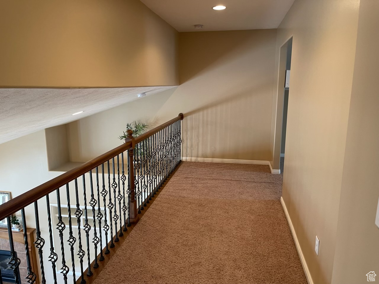 Hallway featuring carpet floors