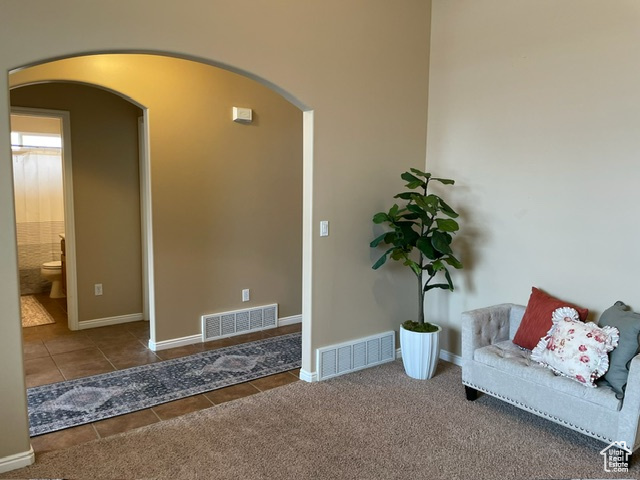 Formal living room/office to main hallway across from guest bath.