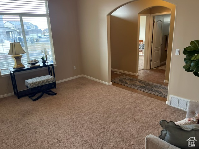 Interior space featuring light colored carpet