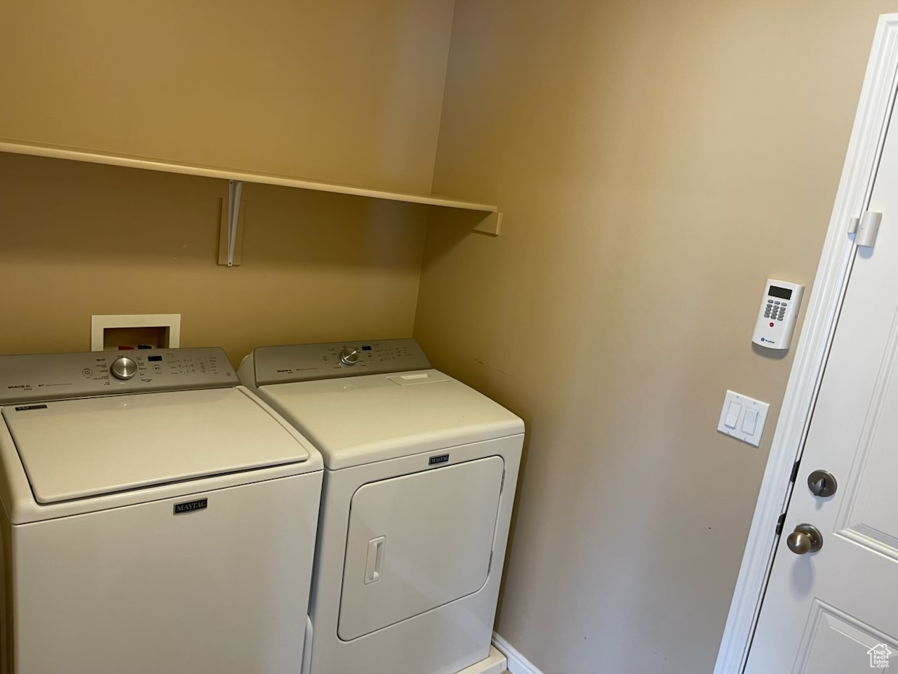 Washroom featuring washer and dryer