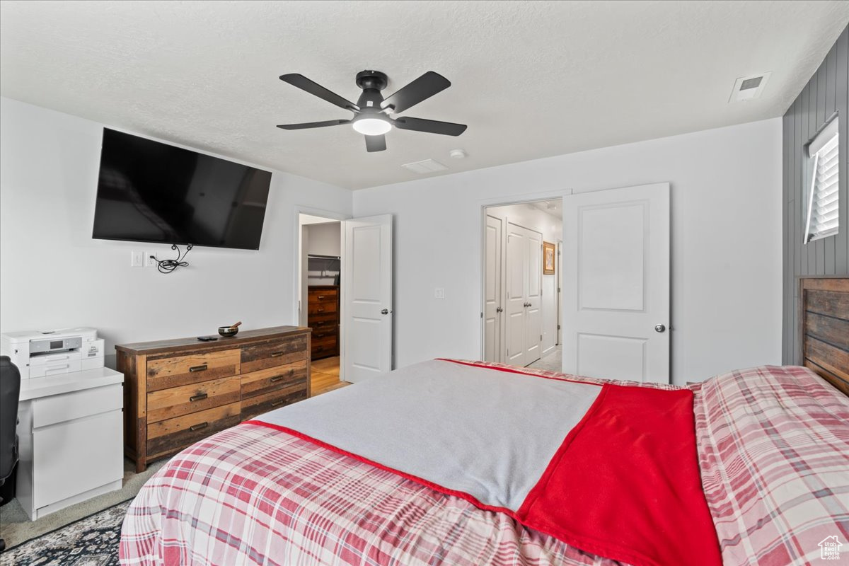 Bedroom with a closet and ceiling fan