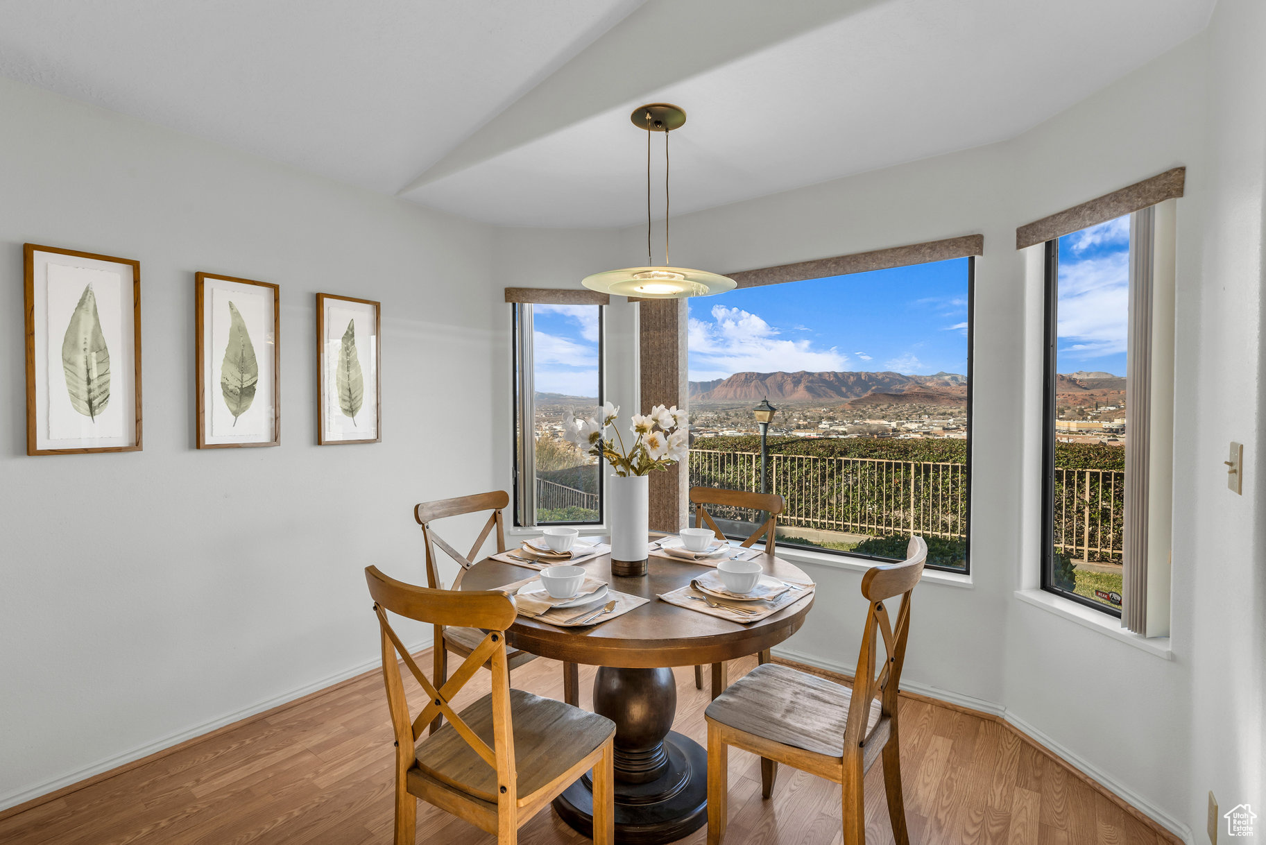 Dining space with a mountain view and light hardwood / wood-style floors