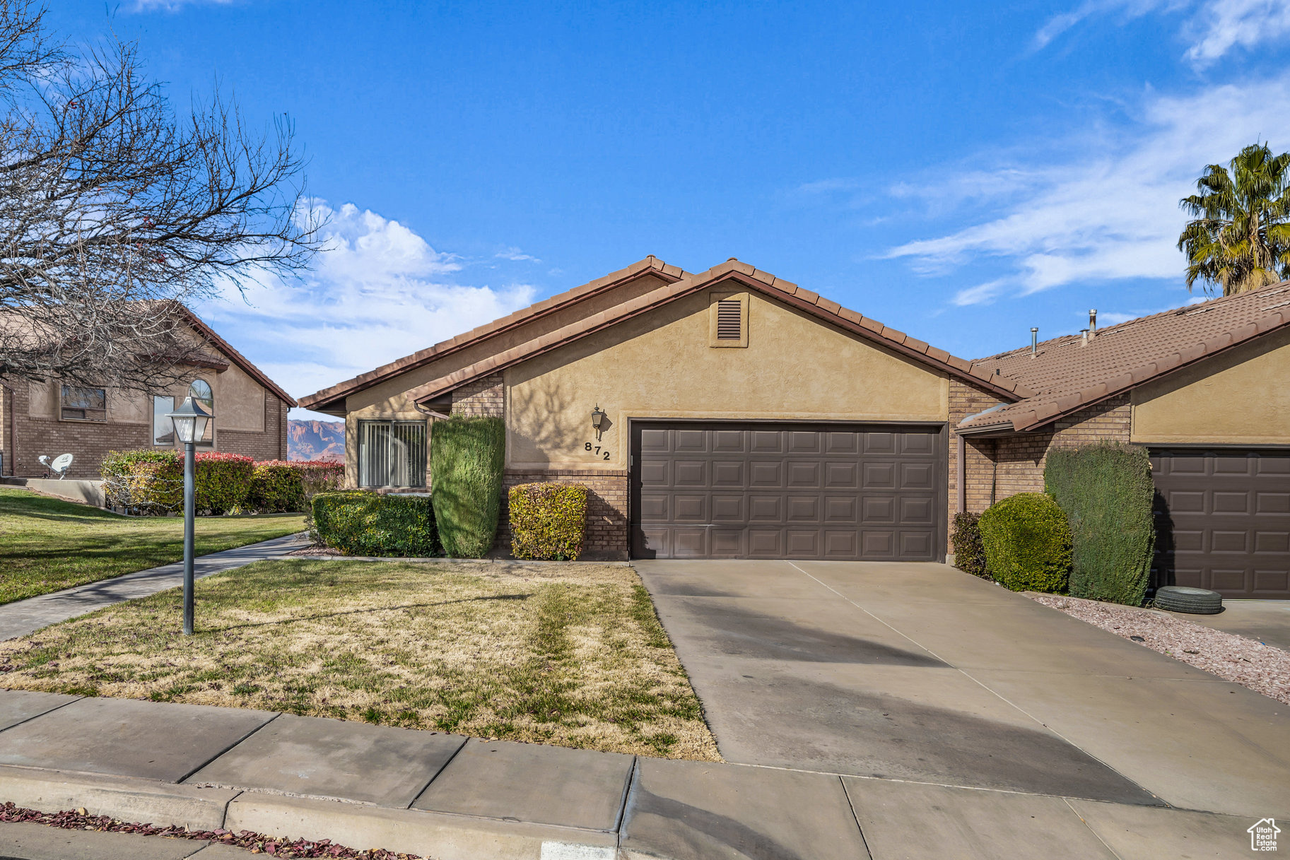 Single story home featuring a front lawn