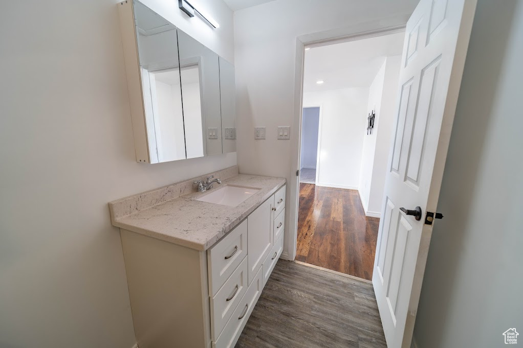 Bathroom featuring vanity and hardwood / wood-style flooring