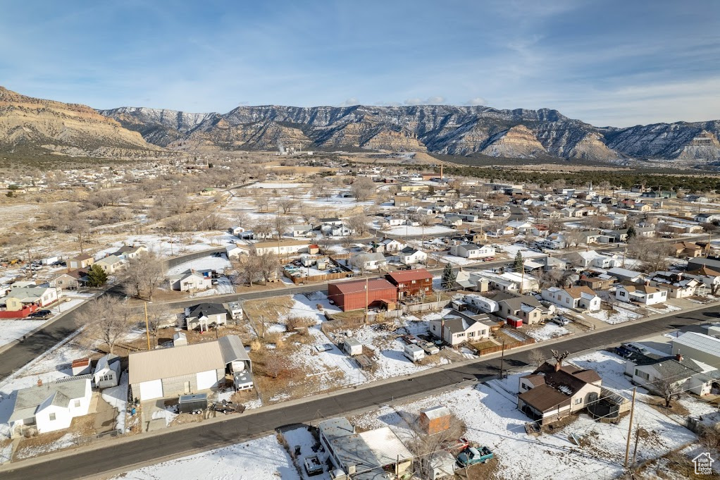 Snowy aerial view featuring a mountain view